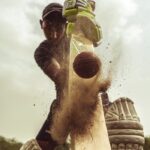 Low Angle Shot of Man Playing Cricket